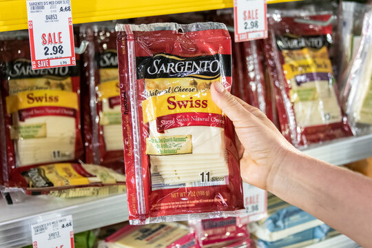 Los Angeles CA, USA January 31st 2022 Shoppers hand holding a package of Sargento brand sliced natural swiss cheese