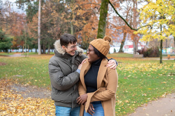 hug, couple laughing outside, rainy cold weather