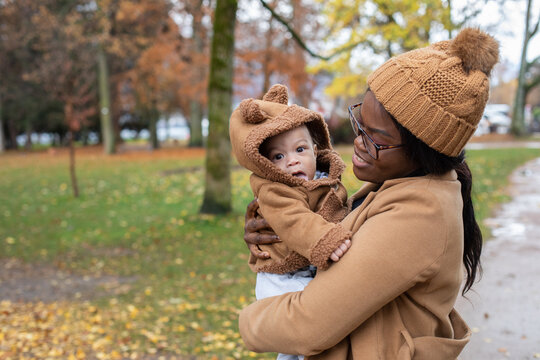 mother with baby portrait outdoors in autumn park