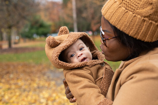 cute newborn baby portrait outdoors in autumn park