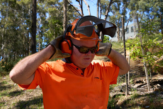 Tradie Putting Hearing Protection