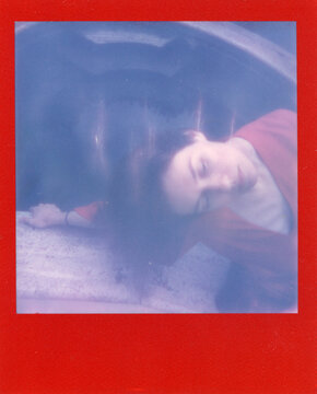 a dreamy woman in red near a swimming pool