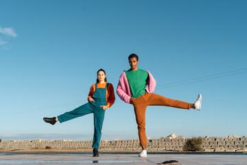 Cool friends listening to music posing and dancing