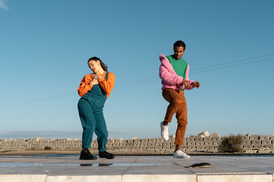 Cool friends listening to music and dancing