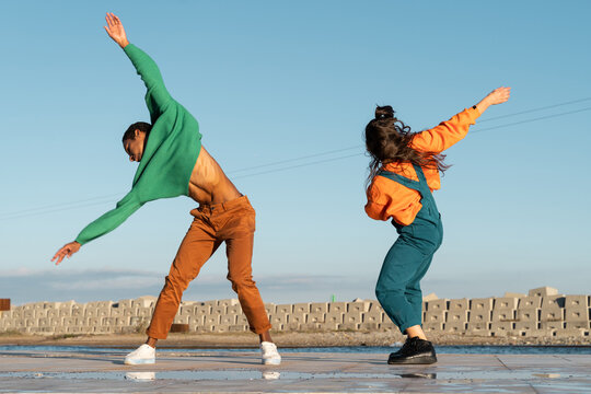 Cool friends listening to music and dancing