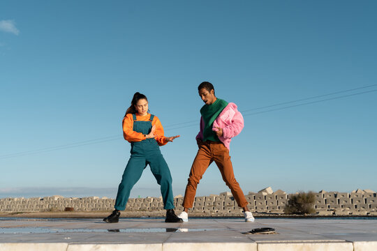 Cool friends listening to music and dancing