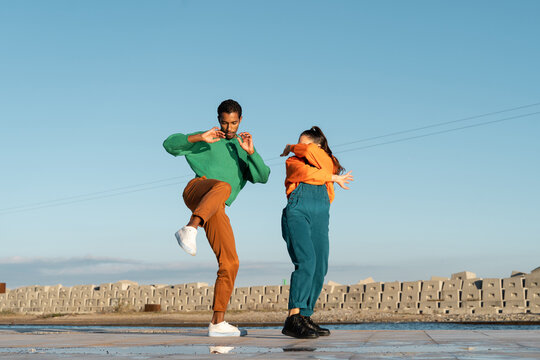 Cool friends listening to music and dancing
