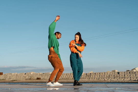 Cool friends listening to music and dancing