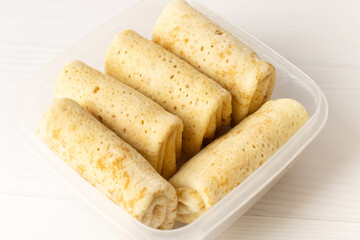 Frozen pancakes with meat in the freezer in the store