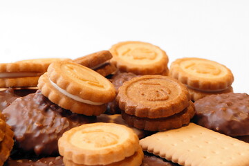 Cookies of different types and shapes lie on top of each other