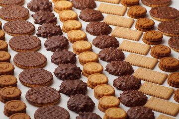 Beautifully stacked chocolate chip cookies, glazed, round filled and rectangular crackers