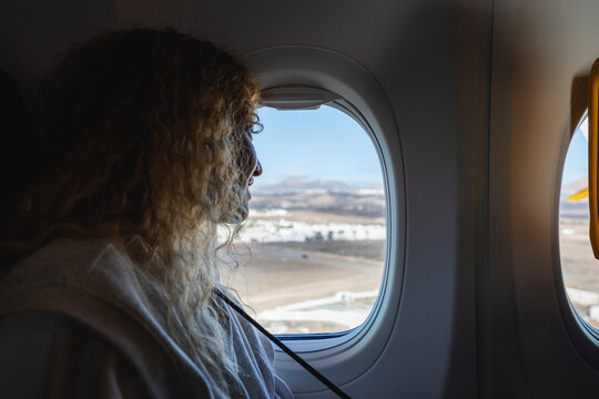 Young woman on the airplane