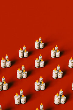 Cartoon Holiday Candles On A Red Background