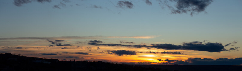 The evening sunset. Panorama. Majestic Storm Clouds. Tragic gloomy sky.