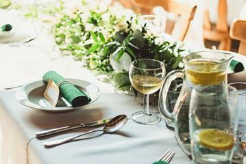 Served tables in a rustic banquet hall 