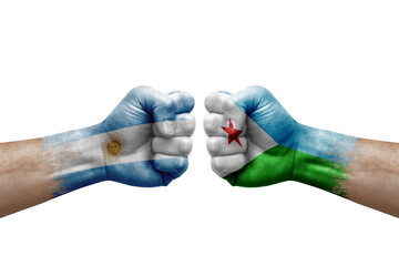 Two hands punch to each others on white background. Country flags painted fists, conflict crisis concept between argentina and djibouti