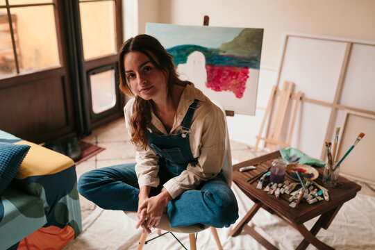 Young artist in her art studio