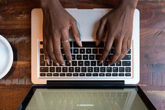 Woman typing on laptop during work