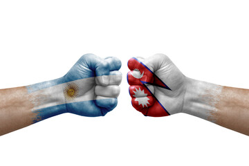 Two hands punch to each others on white background. Country flags painted fists, conflict crisis concept between argentina and nepal