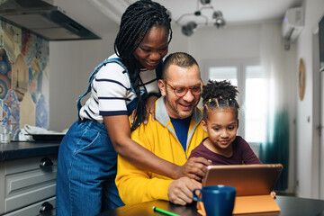 Family Watching Cartoons on Digital Tablet