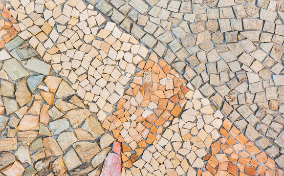 Colorful broken stone collage on ground