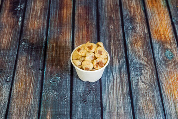 A chocolate chip or chocolate chip cookie is a cookie of American origin with chocolate chips as its distinctive ingredient. The traditional recipe combines a dough based on butter and brown sugar