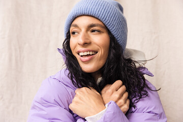 Model wearing winter beanie and puffer