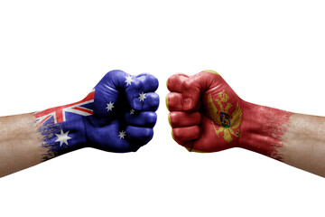 Two hands punch to each others on white background. Country flags painted fists, conflict crisis concept between australia and montenegro