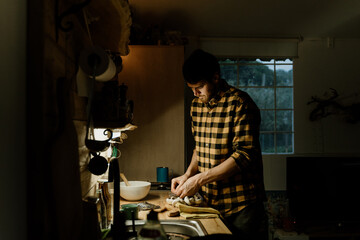 Man batch cooking at home kitchen