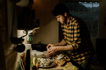 Man batch cooking at home kitchen