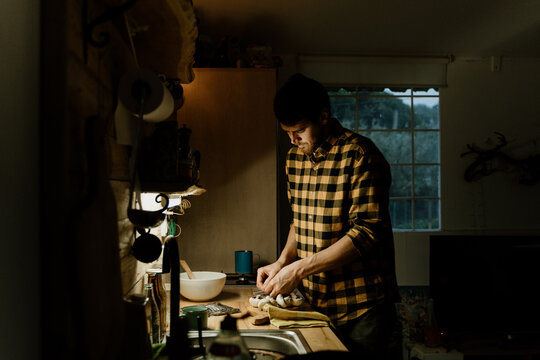 Man batch cooking at home kitchen