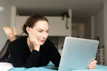 Woman looking at laptop