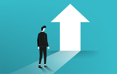 Fototapeta premium Businessman walking towards the bright door symbol.