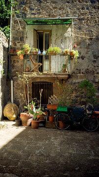 Wonderfully cosy Italian balcony with art and flower pots 