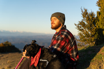 Portrait of confident happy man using phone in nature