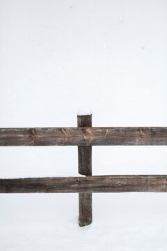 wooden fence covered by the snow