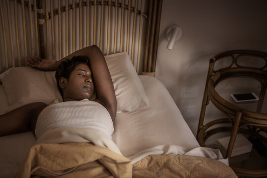 Sunlight peeking into the bedroom of a woman sleeping