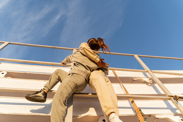 Brave frirends climbing truck and hugging