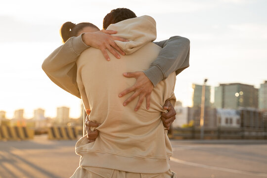 Close-up detail of hugging couple