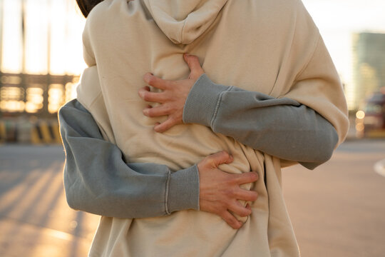 Close-up detail of hugging couple