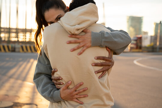 Close-up detail of hugging couple