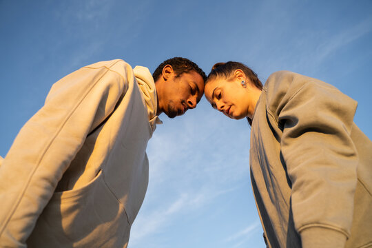 Portrait of head with head friends against blue sky