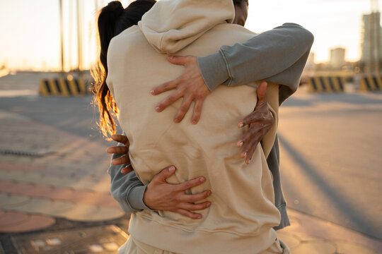 Close-up detail of hugging couple