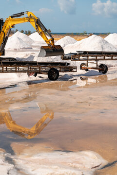 Excavator loading salt