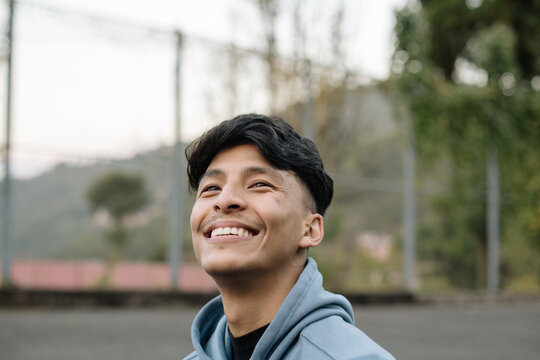 A young and happy south asian man