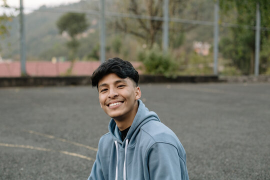 A young and happy south asian man