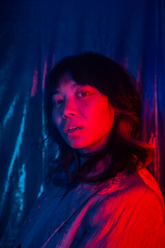 Fashion Portrait Of An Asian Girl With Gel Lights.