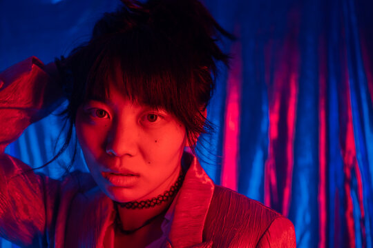 Portrait Of A Cool Asian Girl Looking At Camera.