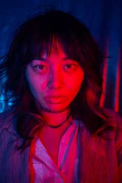 Portrait Of An Asian Girl With Blue And Red Gel Lights.