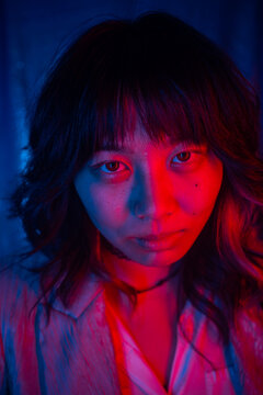 Portrait Of A Beautiful Asian Woman With Gel Lights.